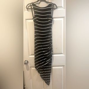 Bebe striped fitted tank dress with asymmetrical bottom size xs black & white